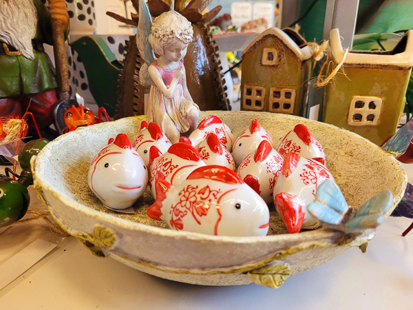 Bird bath with ceramic red and white fish