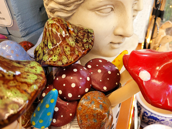 Ceramic mushrooms and a marble women's face