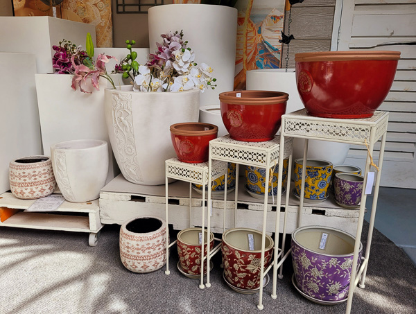 A display of different sized plant pots ranging from small to large